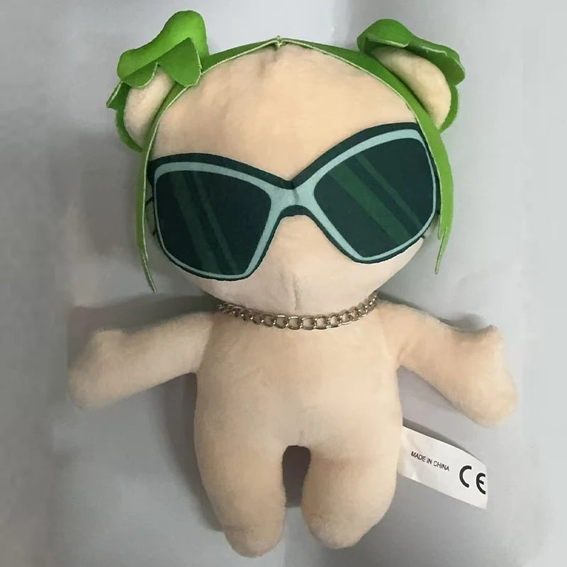A plush doll featuring green hair, sunglasses, and a gold necklace.