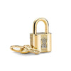 A gold-toned padlock charm bracelet featuring pendants shaped like an elephant, key, butterfly, and heart.