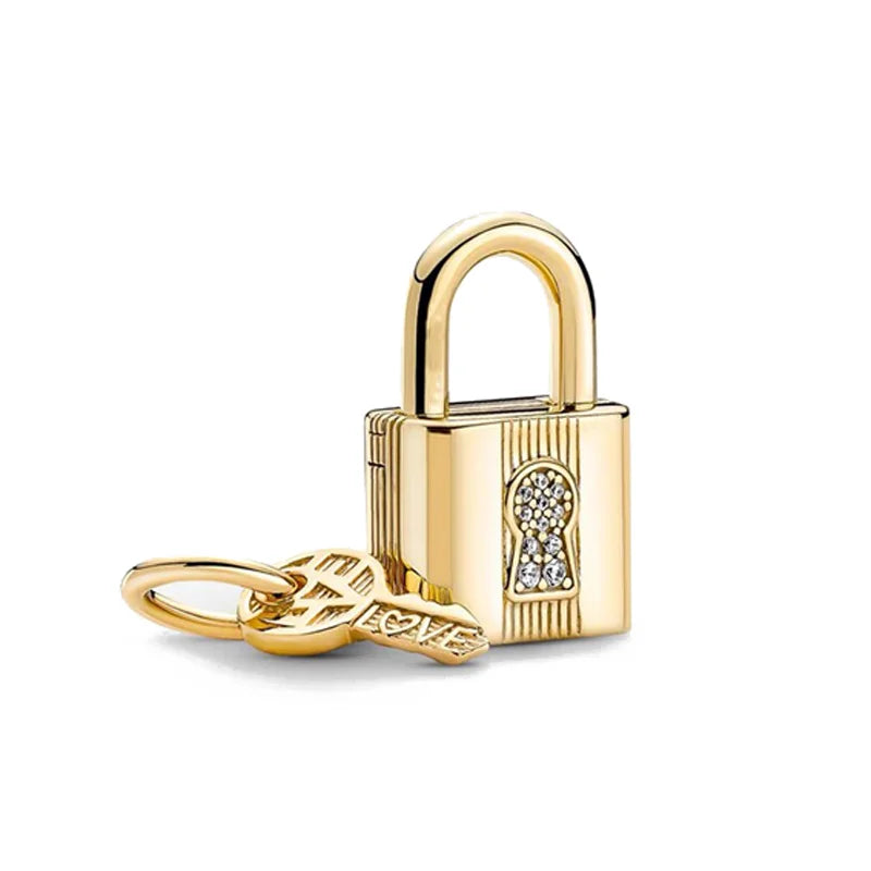 A gold-toned padlock charm bracelet featuring pendants shaped like an elephant, key, butterfly, and heart.