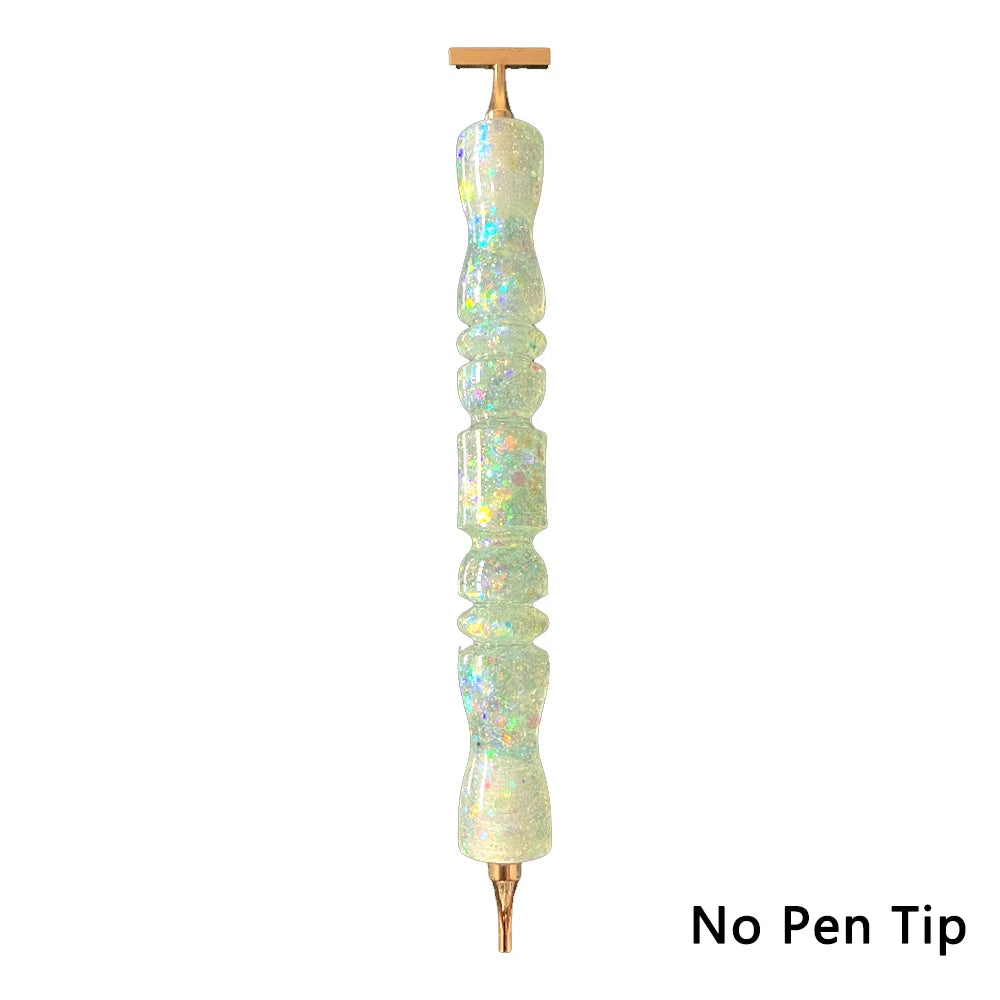 A clear, elongated diamond painting pen with an interchangeable resin tip mounted on a wooden holder.