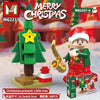 A set of Merry Christmas building blocks featuring a green Christmas tree, a Santa figure, and various festive elements.