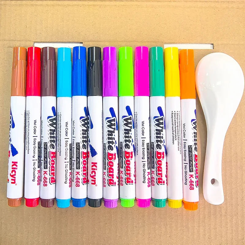 A set of colorful magical water painting pens in various shades and tips arranged in a row next to a white pen holder.