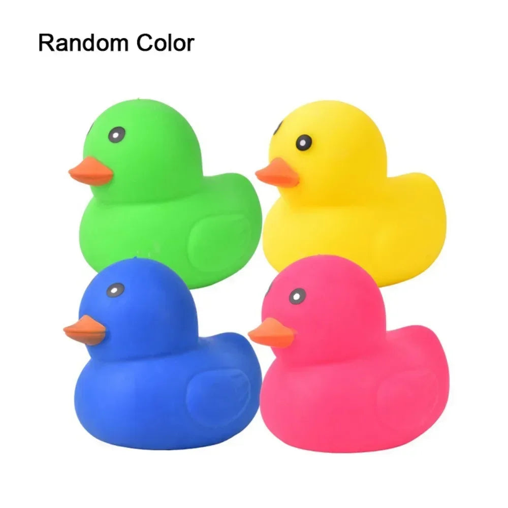 Three plastic duck toys in green, yellow, and pink colors for stress relief