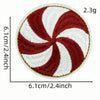 A round iron-on patch featuring a red and white swirl pattern on a white background.