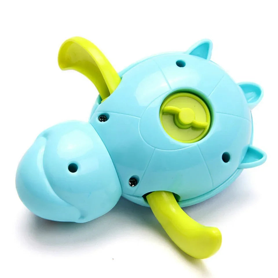 A light blue wind-up swimming turtle bath toy with yellow accents.