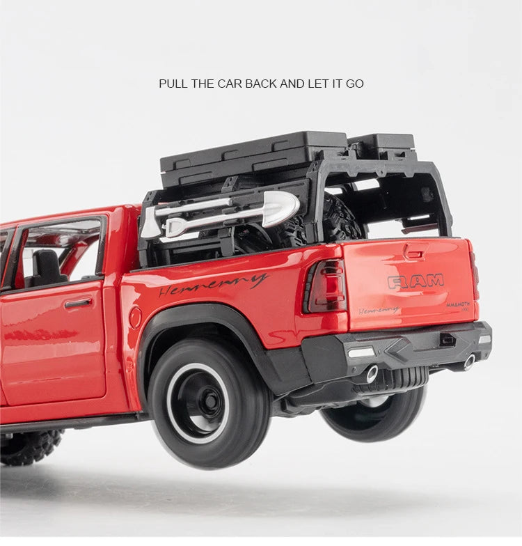 A red RAM pickup truck with a black canopy is shown, ready to be pulled back and let go.