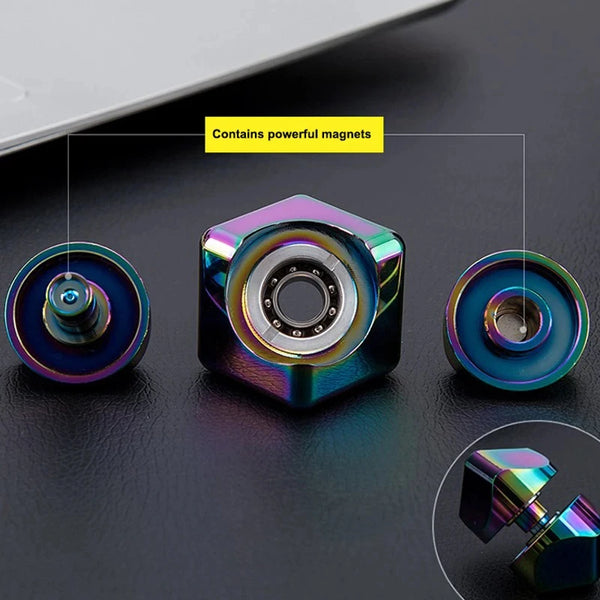A close-up view of an alloy cube spinner fidget toy with powerful magnets, showing its metallic finish.