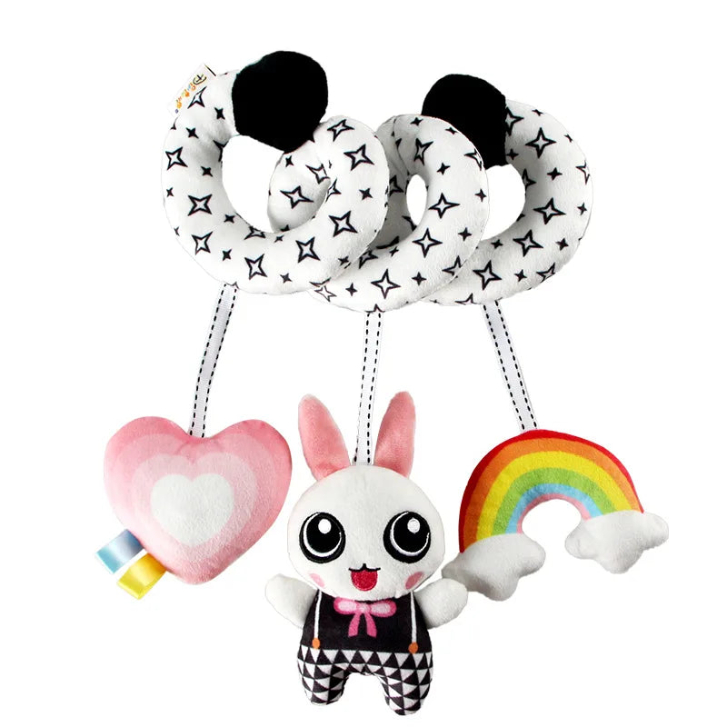 Un set de miroirs-rattles de développement avec une tête de lapin et un anneau arc-en-ciel.
