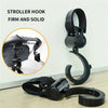 A black stroller hook is shown, featuring a firm and solid design for securing items.