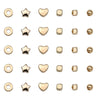 A collection of 580 gold and silver plated beads in various shapes including round, star, heart, and square forms for jewelry