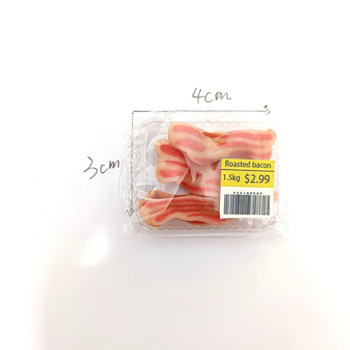 A package of roasted bacon rolls with dimensions marked on the packaging.