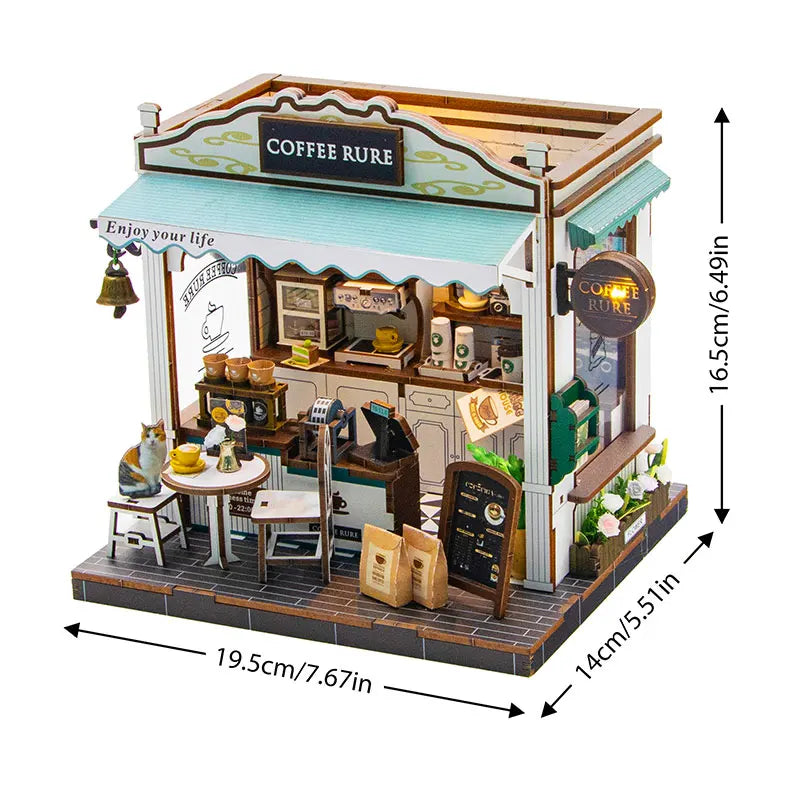 A miniature dollhouse kit featuring a coffee cure shop facade with wooden furniture and warm lighting.