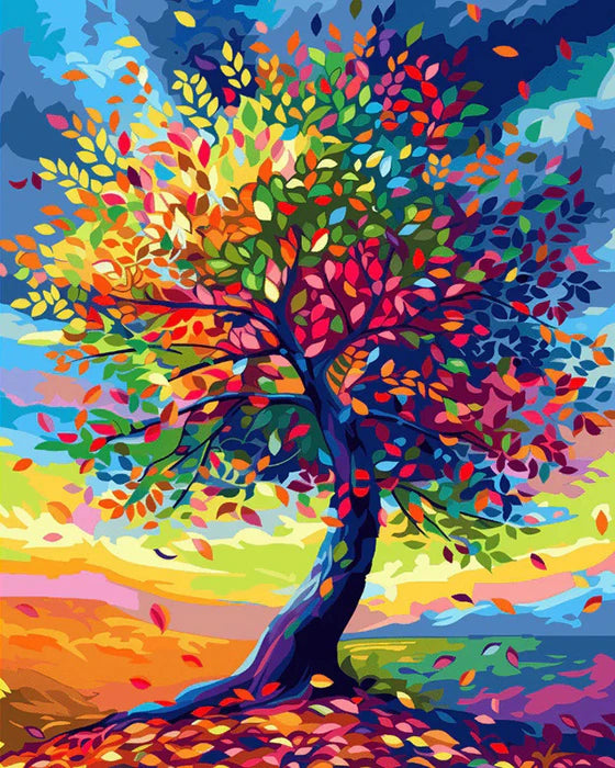 Vibrant autumn tree with colorful leaves against a bright sky and landscape.