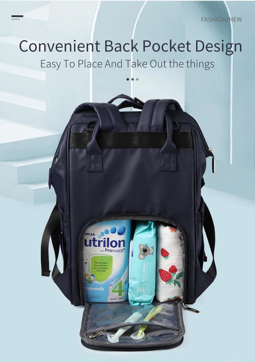 A dark blue waterproof diaper backpack with a convenient back pocket design, showing various items inside.