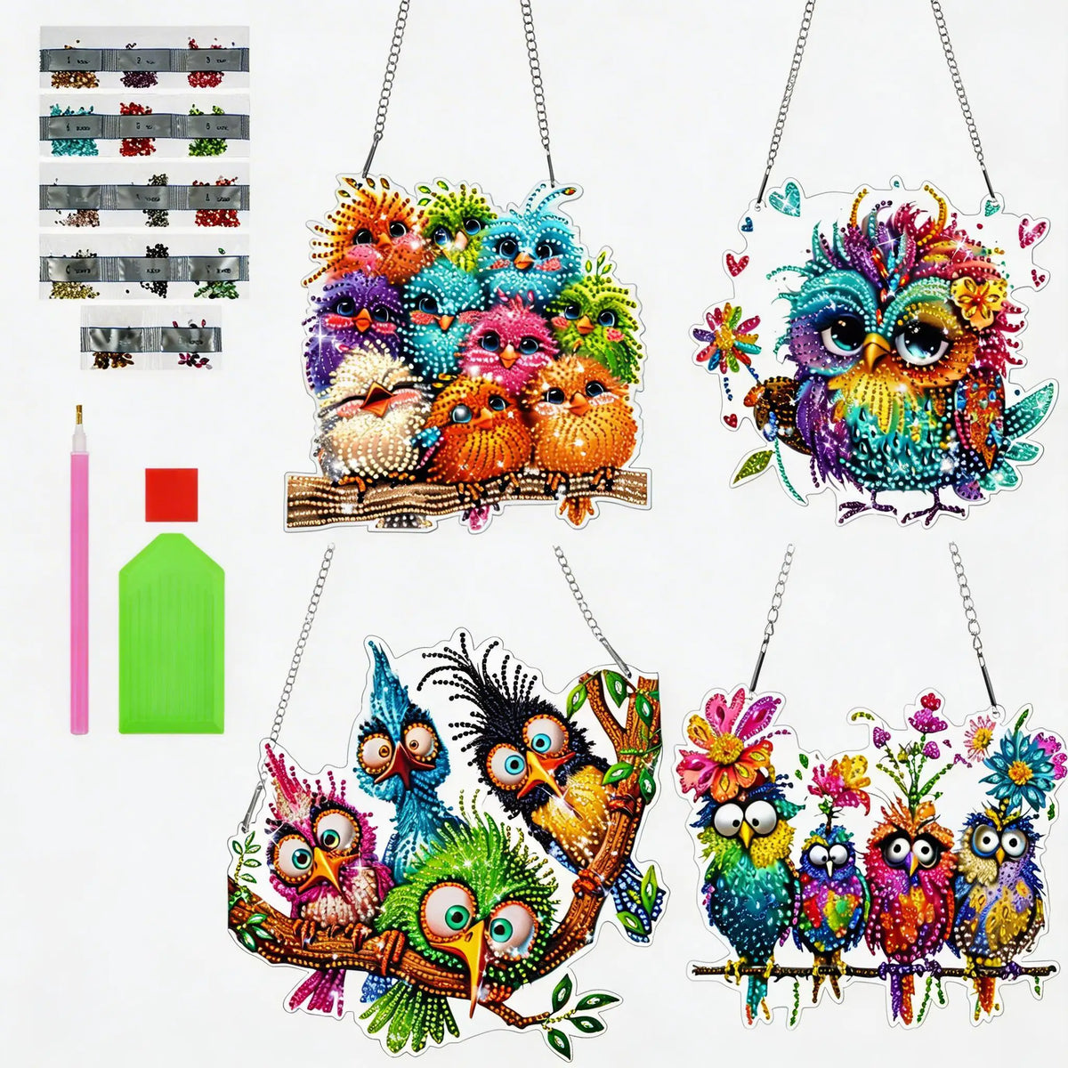 A set of diamond art acrylic pendants shaped like colorful, detailed owls and other birds.