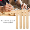 A set of five wooden carving chisels with sharp steel blades being used to engrave wood.