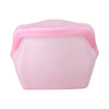 A pink reusable silicone storage bag with a slightly domed shape.