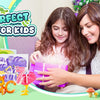 A woman is helping a girl assemble a colorful cardboard puzzle set featuring animals and vehicles.