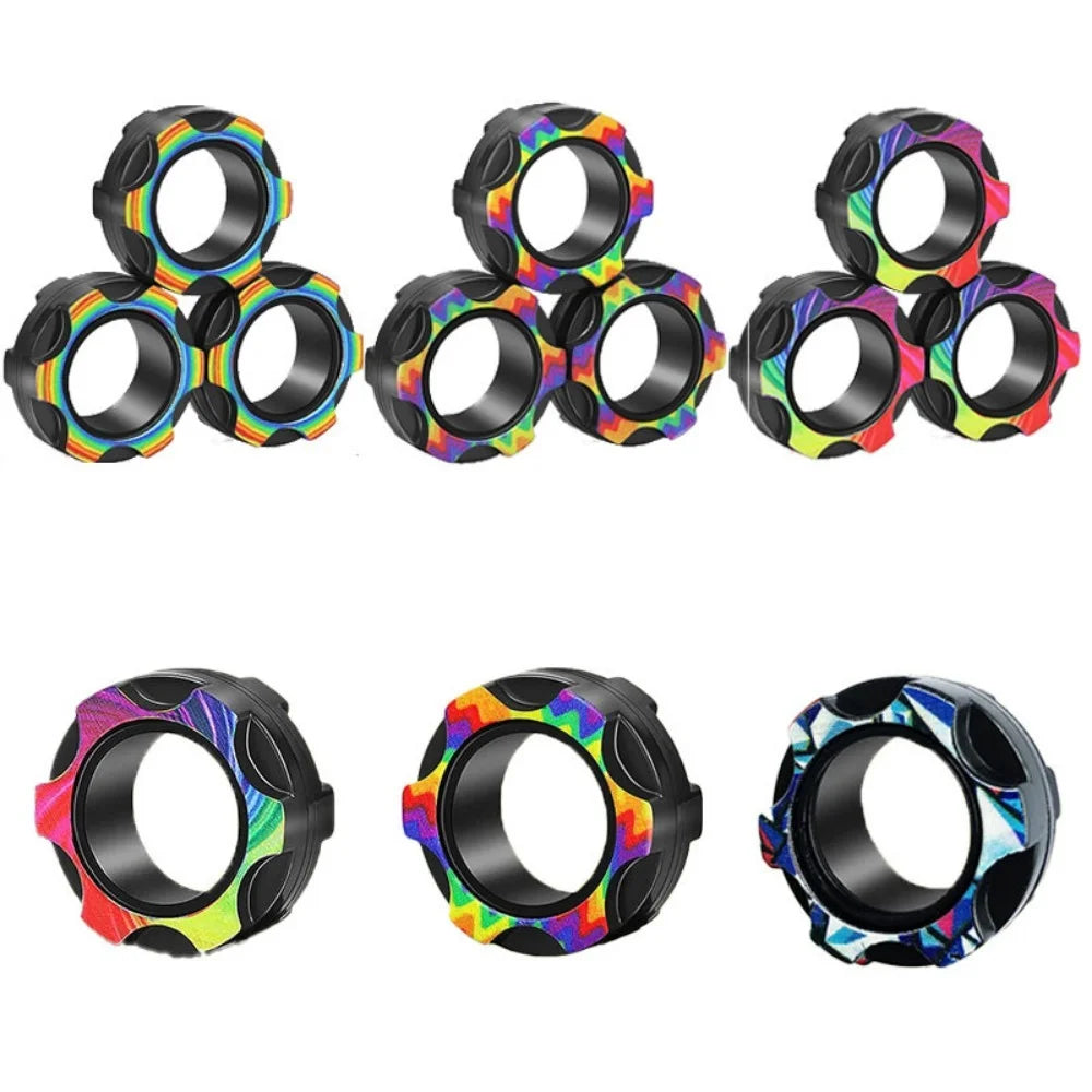 A set of three magnetic fidget spinning rings in various colors and patterns for stress relief.