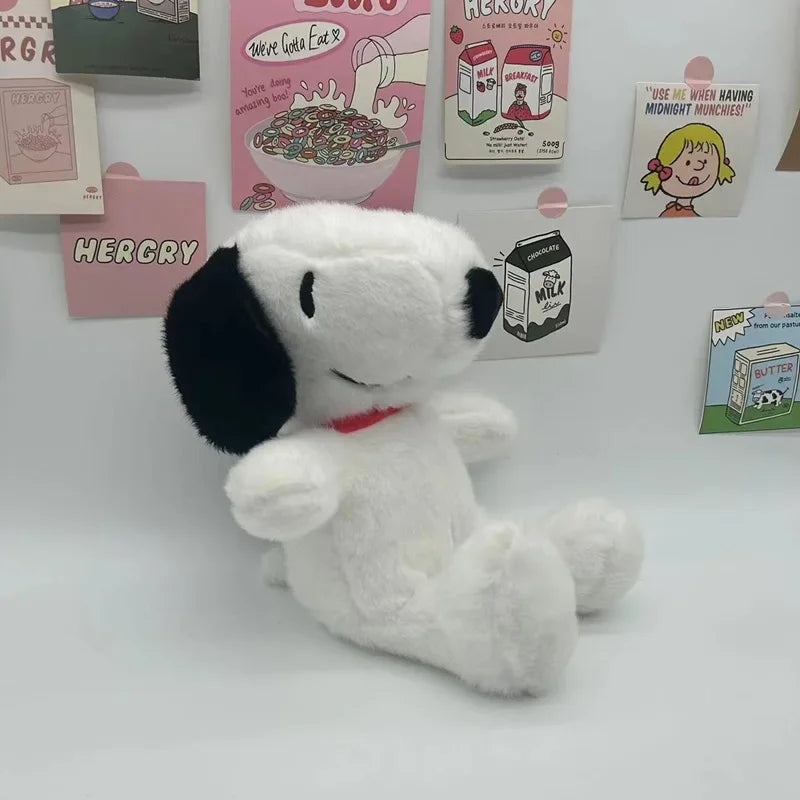 A white Snoopy cartoon plush toy pillow is displayed in front of various themed posters.