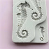 A silicone mold featuring detailed, intricate seahorse shapes for resin and clay crafts.