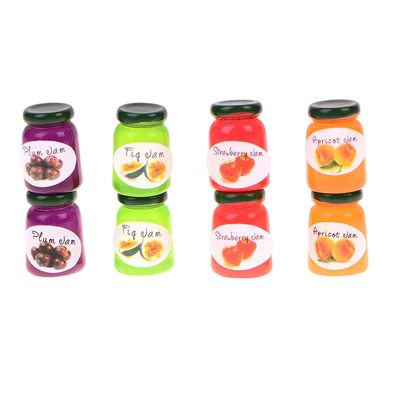 A set of five miniature ceramic jam jars in various colors and fruit designs for dollhouse kitchens