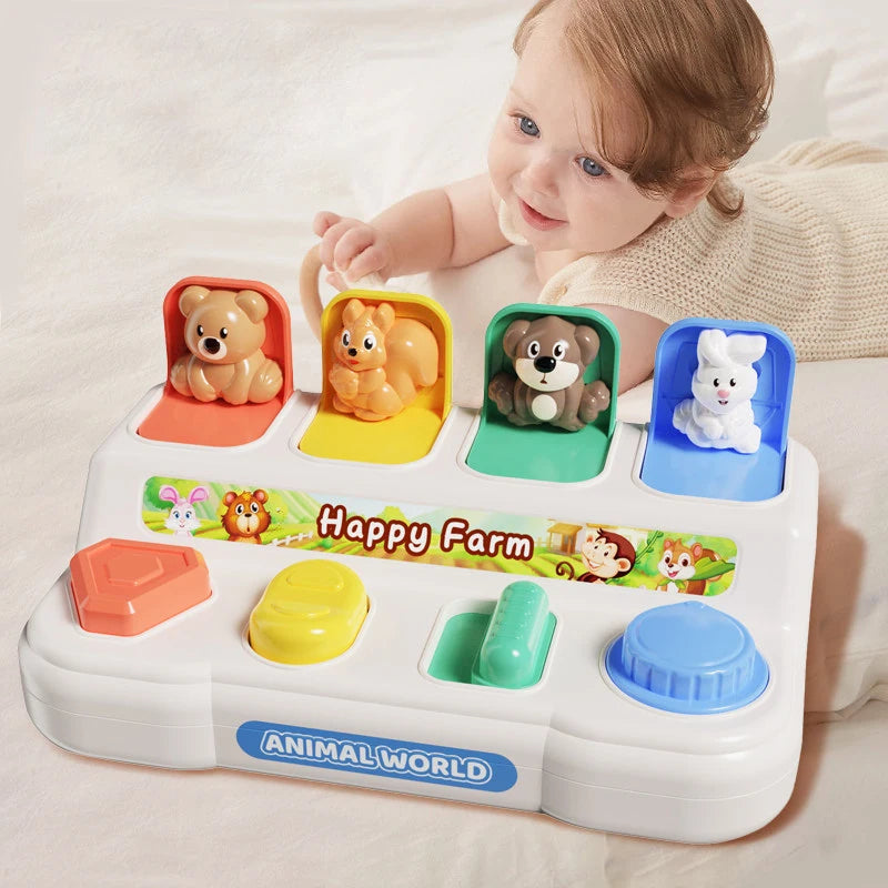 Jouet animal interactif blanc avec ours, renard et lapin sur un plateau coloré.