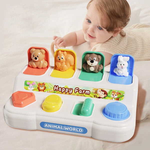 A white interactive pop-up animal toy featuring various farm animals like a bear, fox, and rabbit on a colorful tray.