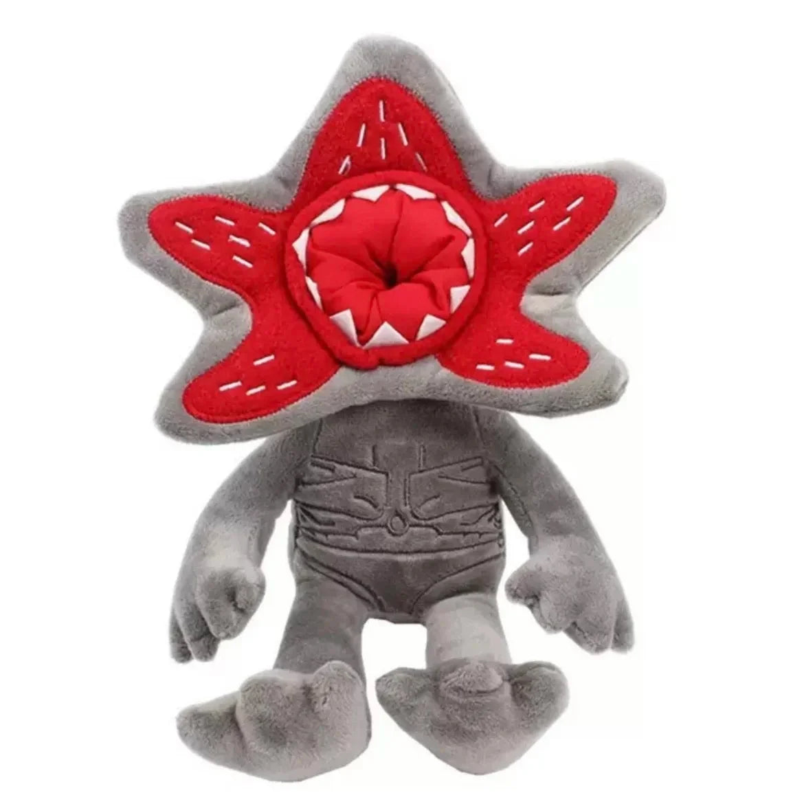 A plush doll set featuring Eleven, Mike, and the Demogorgon with red and gray features.