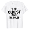 A white t-shirt with black text that reads I'm the oldest I make the rules