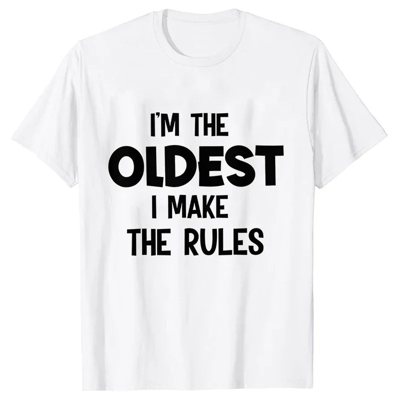 A white t-shirt with black text that reads I'm the oldest I make the rules