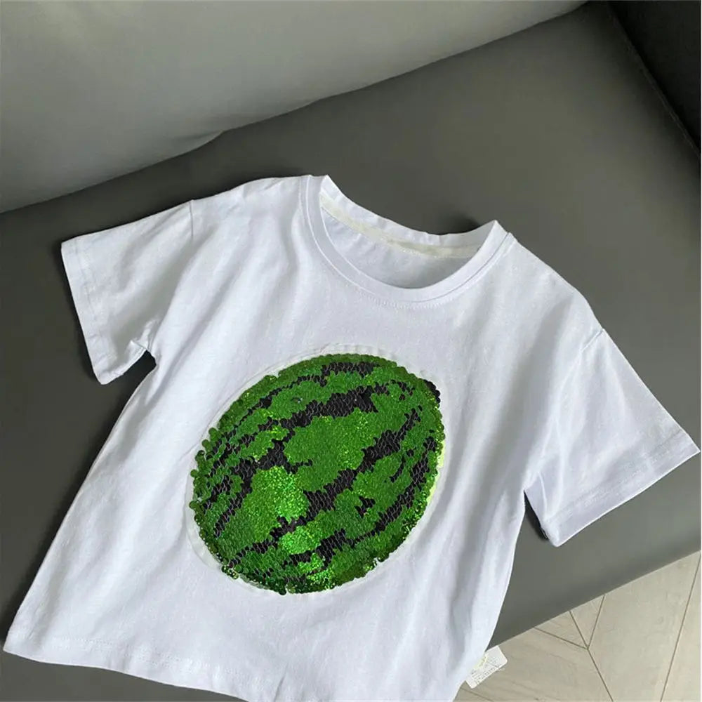 White t-shirt featuring a green sequin watermelon design on the front.