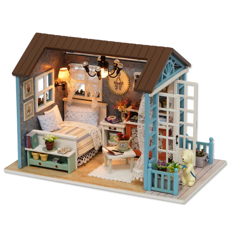 A miniature wooden dollhouse kit featuring a cozy bedroom with furniture and decorative elements.