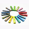 A collection of colorful wooden harmonicas featuring various cartoon animal designs arranged in a circle.