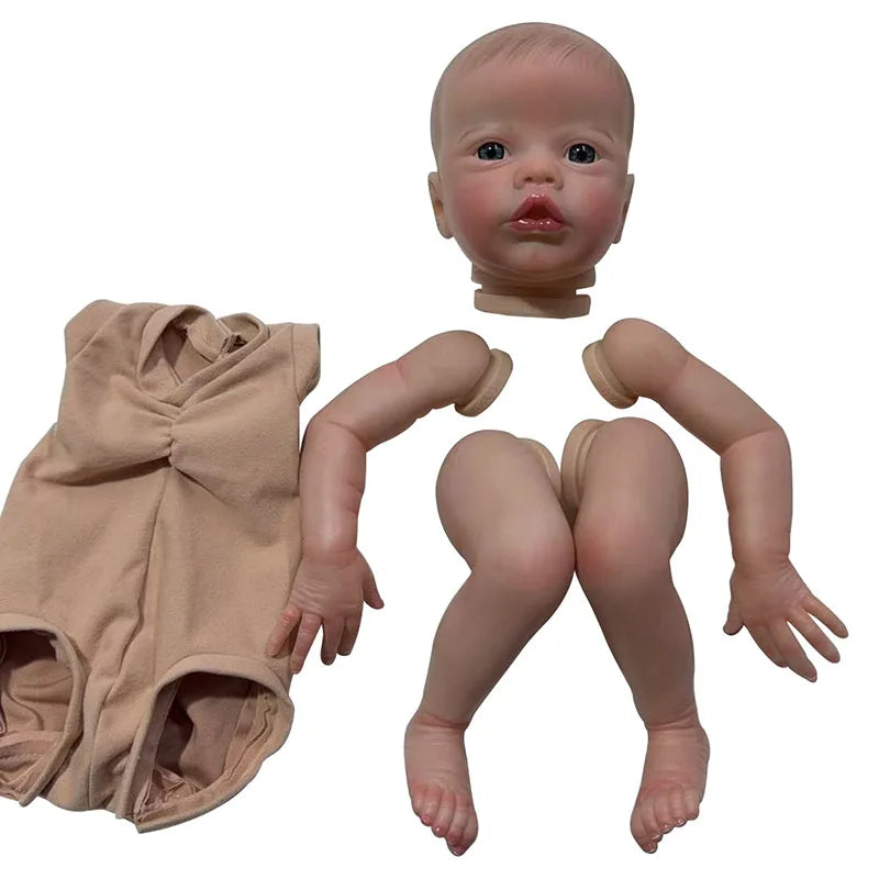 A realistic reborn baby doll kit with painted details and a cloth body, shown from the front.