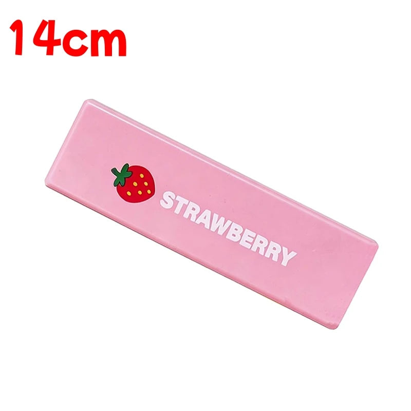 Pink rectangular squishy butter stick fidget toy with a strawberry design