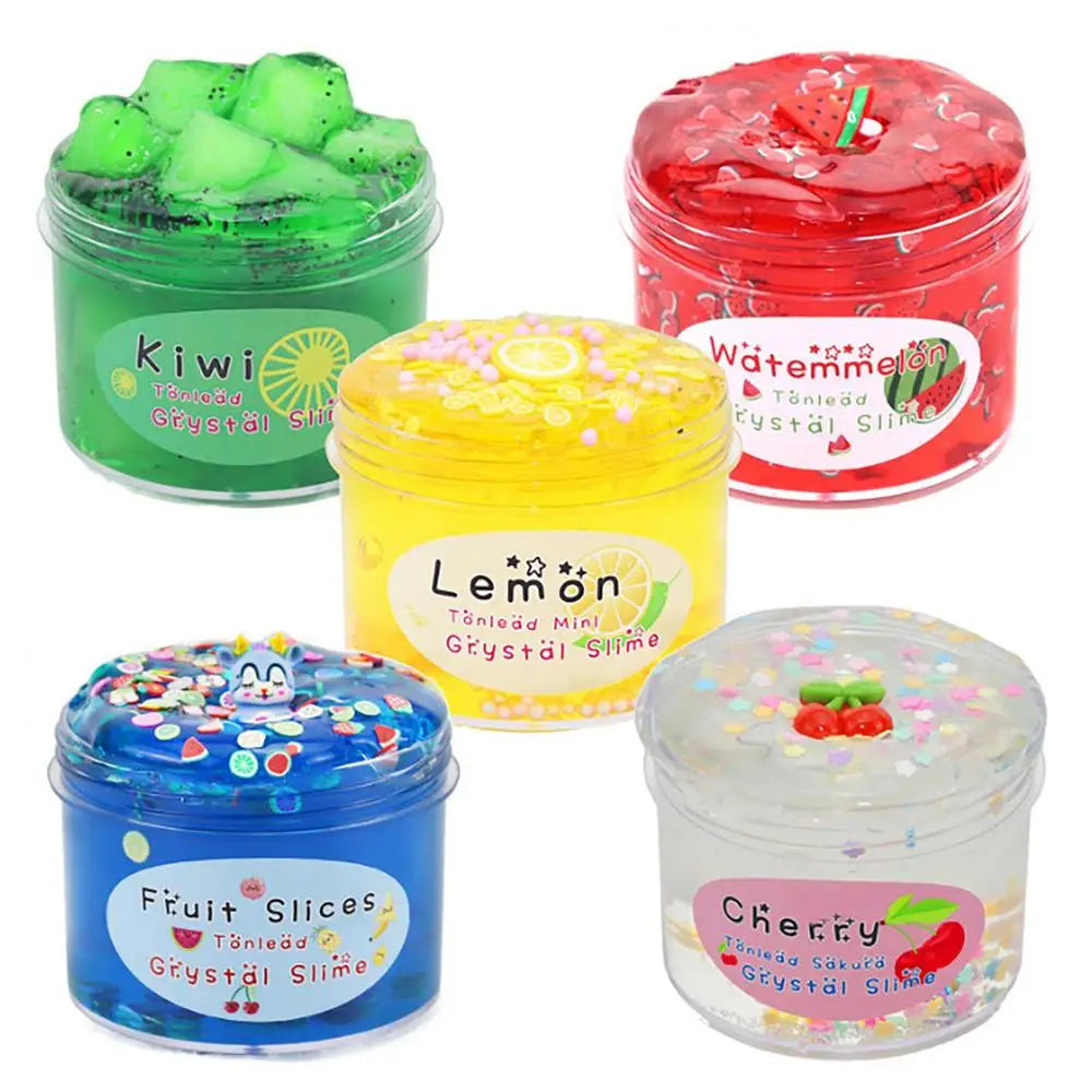 A collection of four jars of colorful slime putty including green, red, yellow, and clear pink varieties.