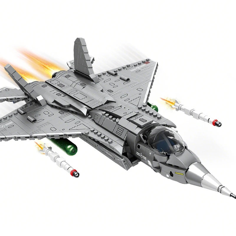A gray J35 fighter jet model kit is shown in flight with missile trails against a white background.