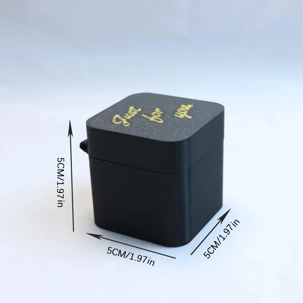 A black gift box with gold text that reads Just for you, shown from above.