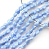 A strand of light blue heart-shaped acrylic beads for jewelry making