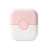 A pink and white 2-in-1 baby hair cutting comb with a dual-edge blade.