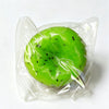 A bright green watermelon kiwi squishy stress ball fidget toy is sealed in a clear plastic bag.