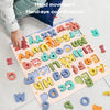 A wooden alphabet puzzle set showing various uppercase and lowercase letters scattered on a pink board.