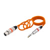 Orange professional XLR to 6.35mm audio cable coiled and terminated for audio connections