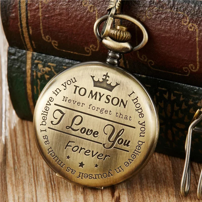 A brass pendant charm engraved with the message I love you forever to my son