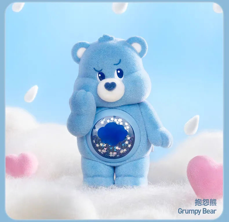 A blue Grumpy Bear Care Bear plush toy standing in soft white snow with falling snowflakes.