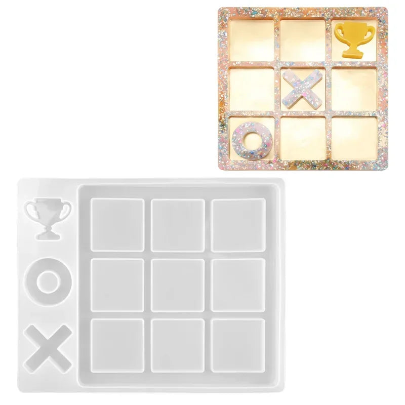 A set of silicone molds for creating customizable tic-tac-toe game pieces, including a yellow trophy and various shapes.