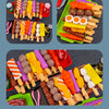 A colorful kids pretend play BBQ grill set featuring various toy foods like sausages, fruits, and vegetables.