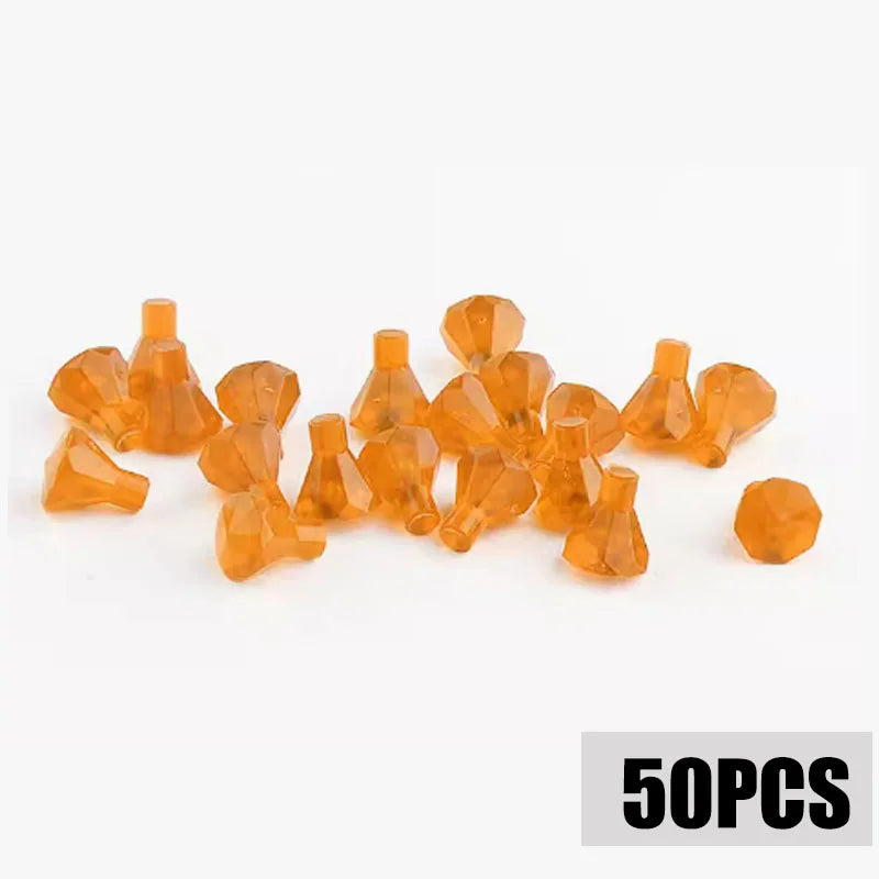 A collection of small, translucent amber-colored building block pieces resembling coins.