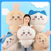 A woman is holding several soft plush dolls of Chiikawa characters, including Hachiware and Usagi.